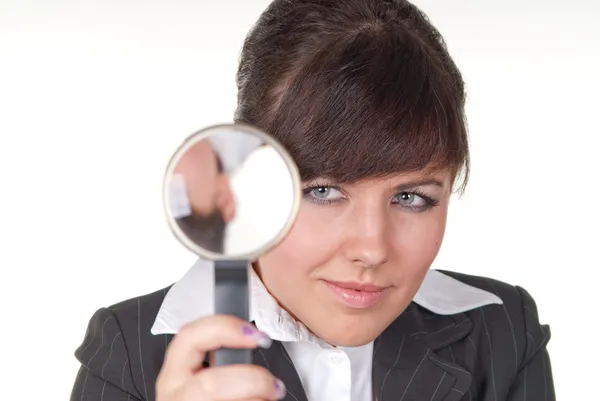 stock image An attractive young woman looking thru a loupe