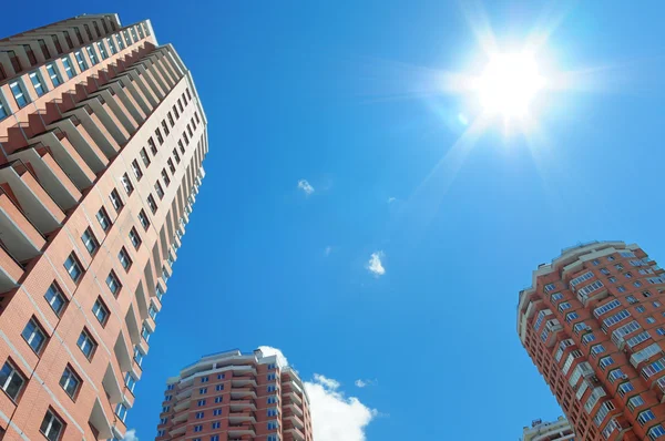 Stock image New houses against shiny sky