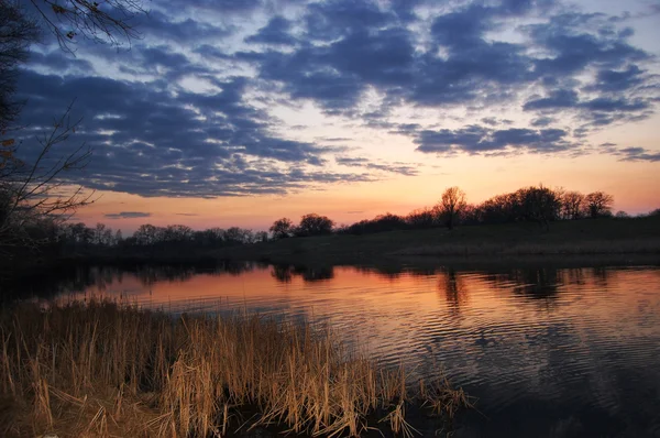 stock image Sunset above the river