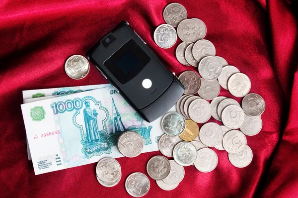 Dinheiro com celular — Fotografia de Stock