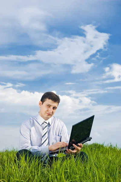 ノートパソコンを持つビジネスマン ストック画像