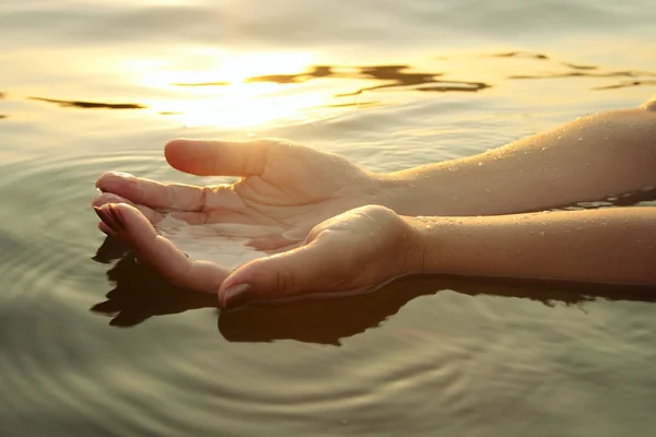 stock image Woman hands in water