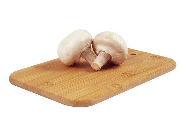 stock image Mushrooms on a wooden board.