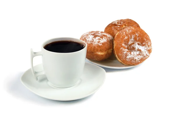 stock image A cup of coffee and saucer with donuts