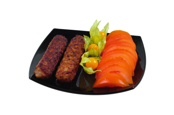 Kebab with vegetable garnish — Stock Photo, Image