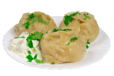 Cooked dumplings on a plate clipart