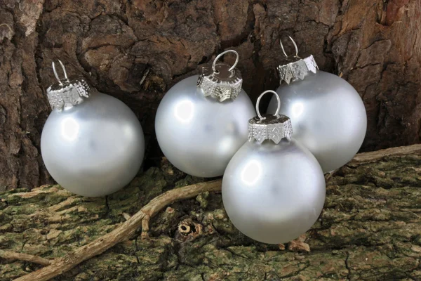 Christmas Baubles on a Yule Log — Stock Photo, Image