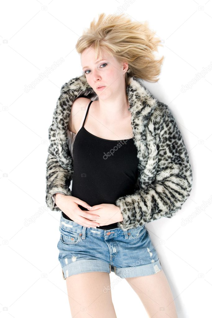 Fashionable teenage girl in fur coat