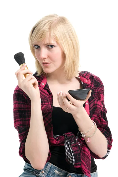 Hermosa adolescente aplicando maquillaje Imagen de archivo