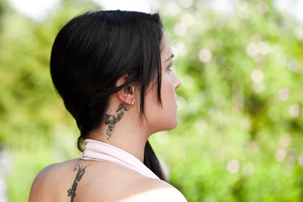 Beautiful yound women with tattoo — Stock Photo, Image