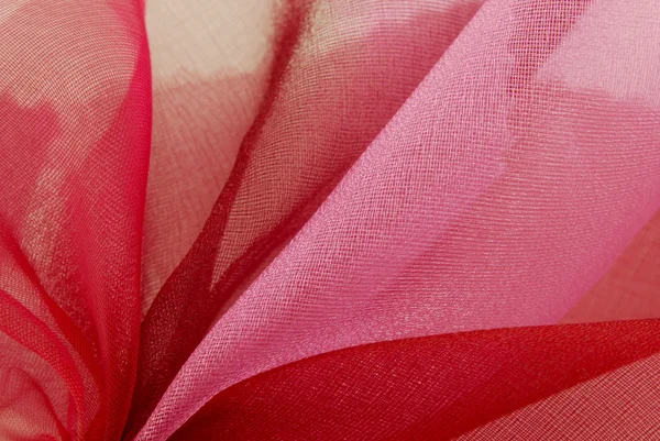 Röd rosa organza tyg textur makro — Stockfoto