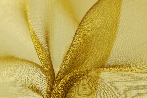 Goldene Textur aus Organza-Stoff — Stockfoto