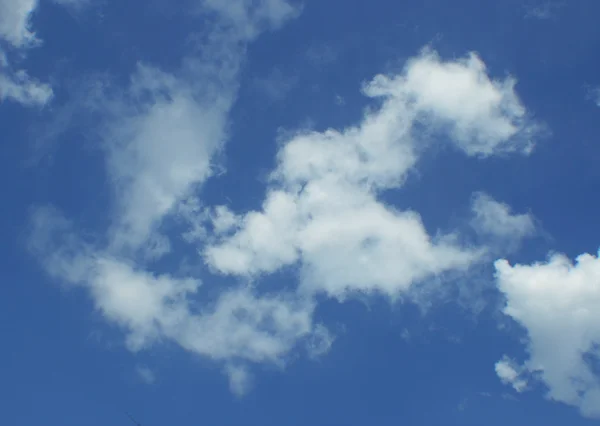 Blue sky with puffy clouds — Stock Photo, Image