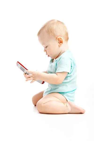 Criança bonito falando em um telefone celular — Fotografia de Stock