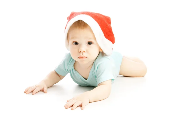 Ребенок в красной рождественской шляпе — стоковое фото