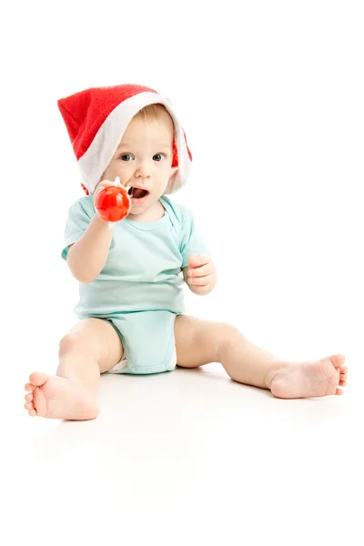 Baby met rode kerstmuts — Stockfoto