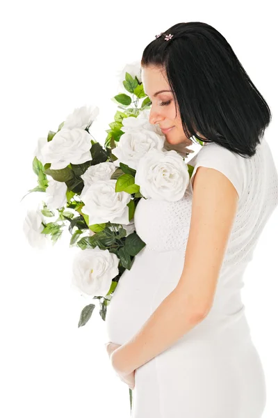 怀孕与玫瑰 免版税图库照片