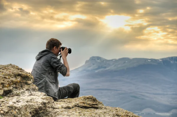 stock image Photographer on rock