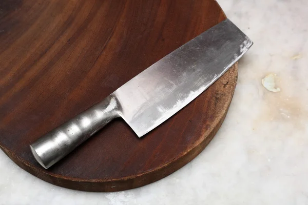 stock image Kitchen knife on cutting board