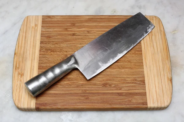 stock image Kitchen knife on cutting board