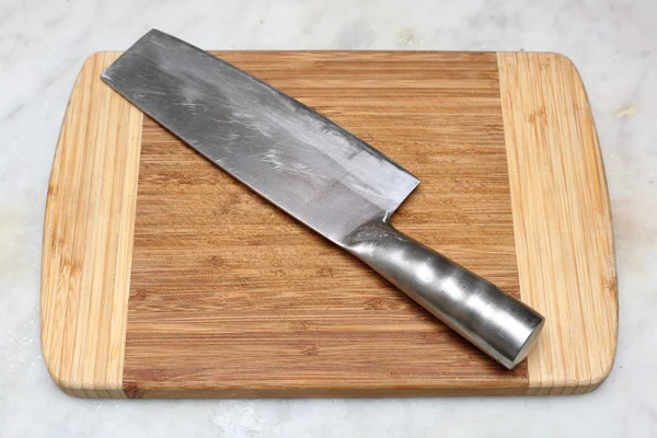 stock image Kitchen knife on cutting board