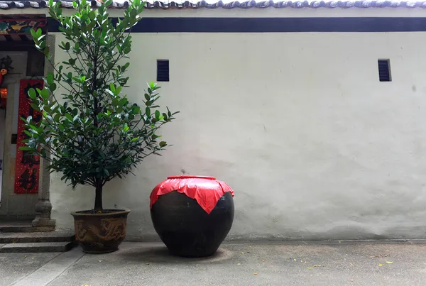 Asian style ceramic pot in front of the — Stock Photo, Image
