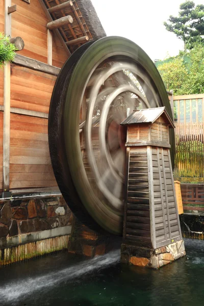 Wooden waterwheel rotating — Stock Photo, Image