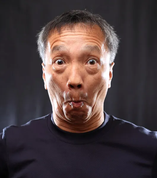 Mature chinese man shocked — Stock Photo, Image