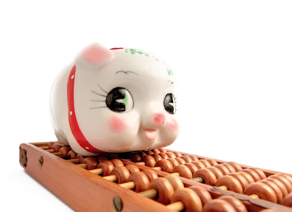 Piggy bank and abacus — Stock Photo, Image