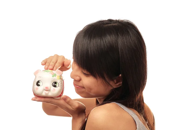 Chinese girl with piggy bank — Stock Photo, Image