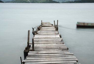 Pier and boat, low saturation clipart