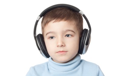 Thoughtful boy in headphones clipart