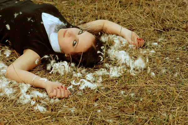Young girl lying on the hay — Stock Photo, Image