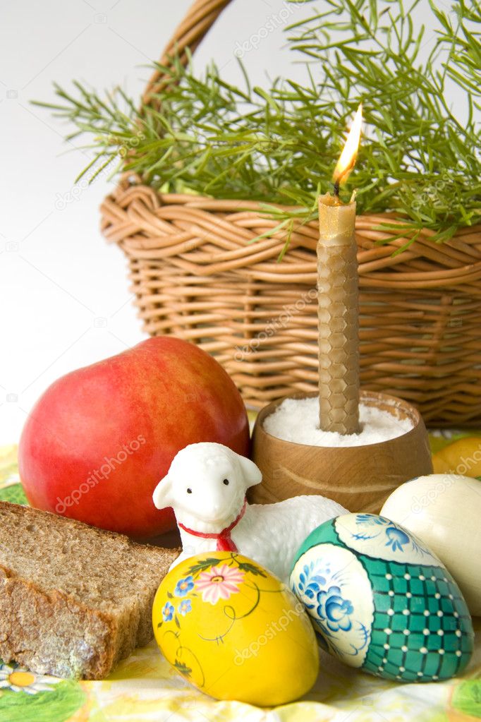 Easter eggs a candle and a lamb