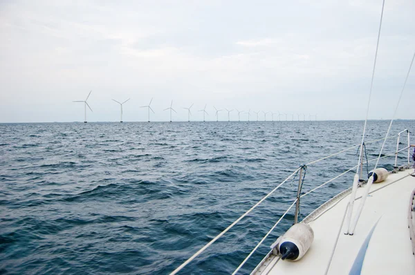Line of windmill turbines from boat — Stock Photo, Image