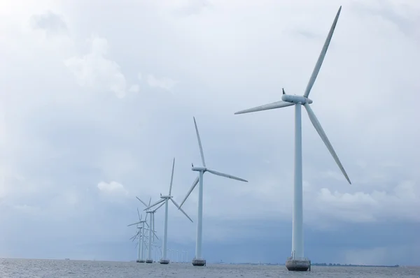 Windmills on cloudy weather, back shot — Stock Photo, Image