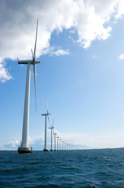 Windmills in a row on sunny day, vertical — Stock Photo, Image