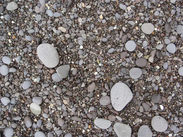 Rocas, arena y guijarros — Foto de Stock