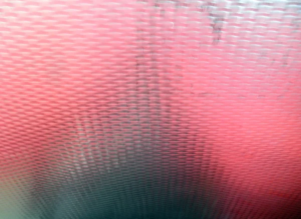 Reflexión roja sobre el patrón de metal — Foto de Stock