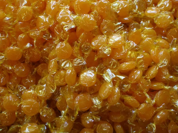 Sweets- many Yummy yellow candy in Wrappers
