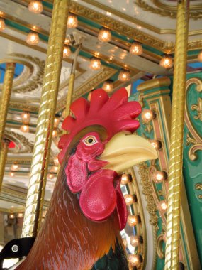 Rooster ON A CAROUSEL clipart