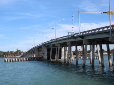 Siesta Keys North Bridge with bird flying over clipart