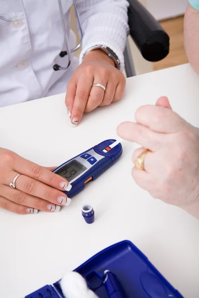 stock image Young doctor check the blood-sugar level