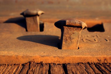 Rusty nails on a railroad track clipart