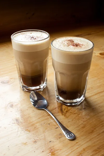 Stock image Two coffees and a spoon