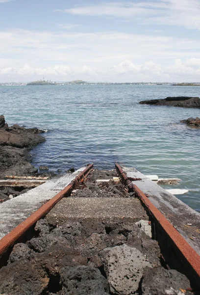 Train track into the ocean — Stock Photo, Image