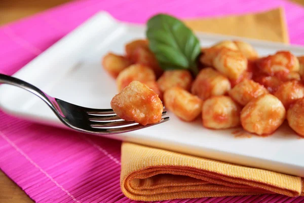 Gnocchi on a fork - blurred background — Stock Photo, Image