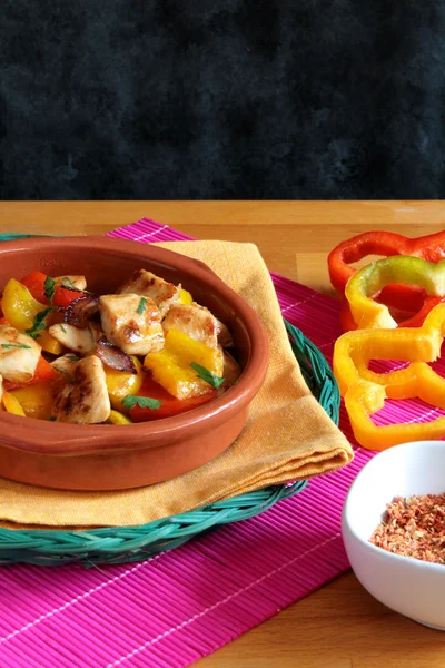 Chicken with red and yellow peppers — Stock Photo, Image