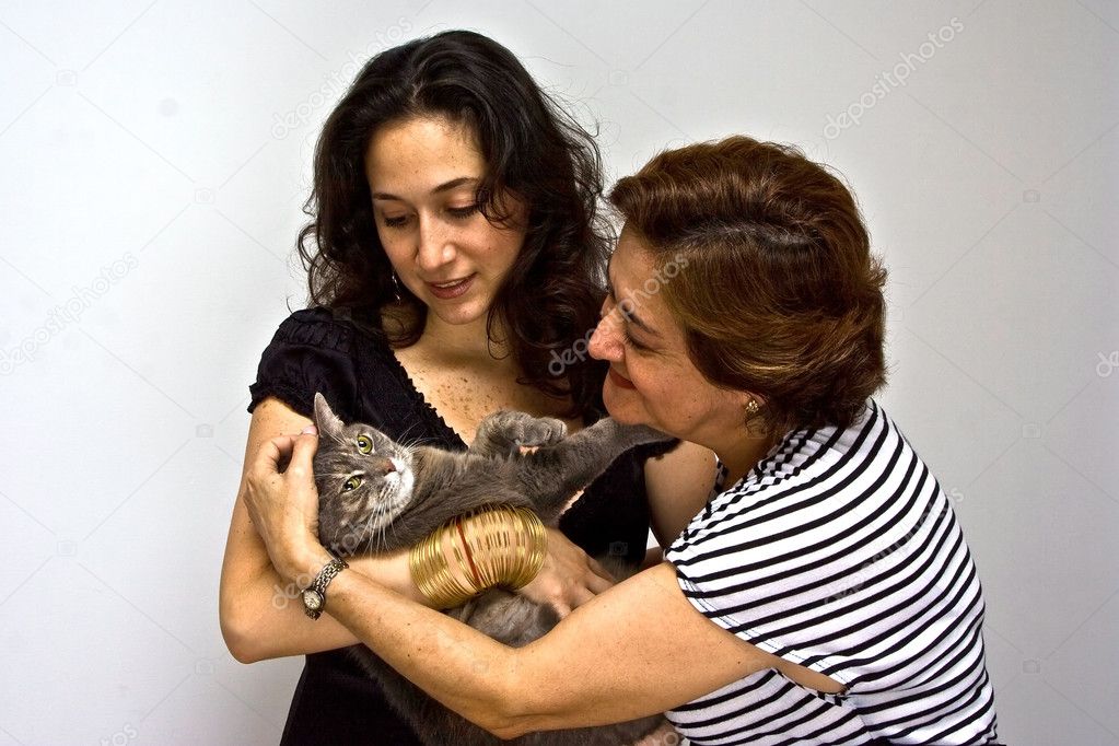 Ladies holding cat