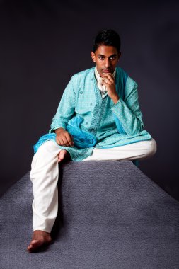 Hindu man sitting and thinking clipart